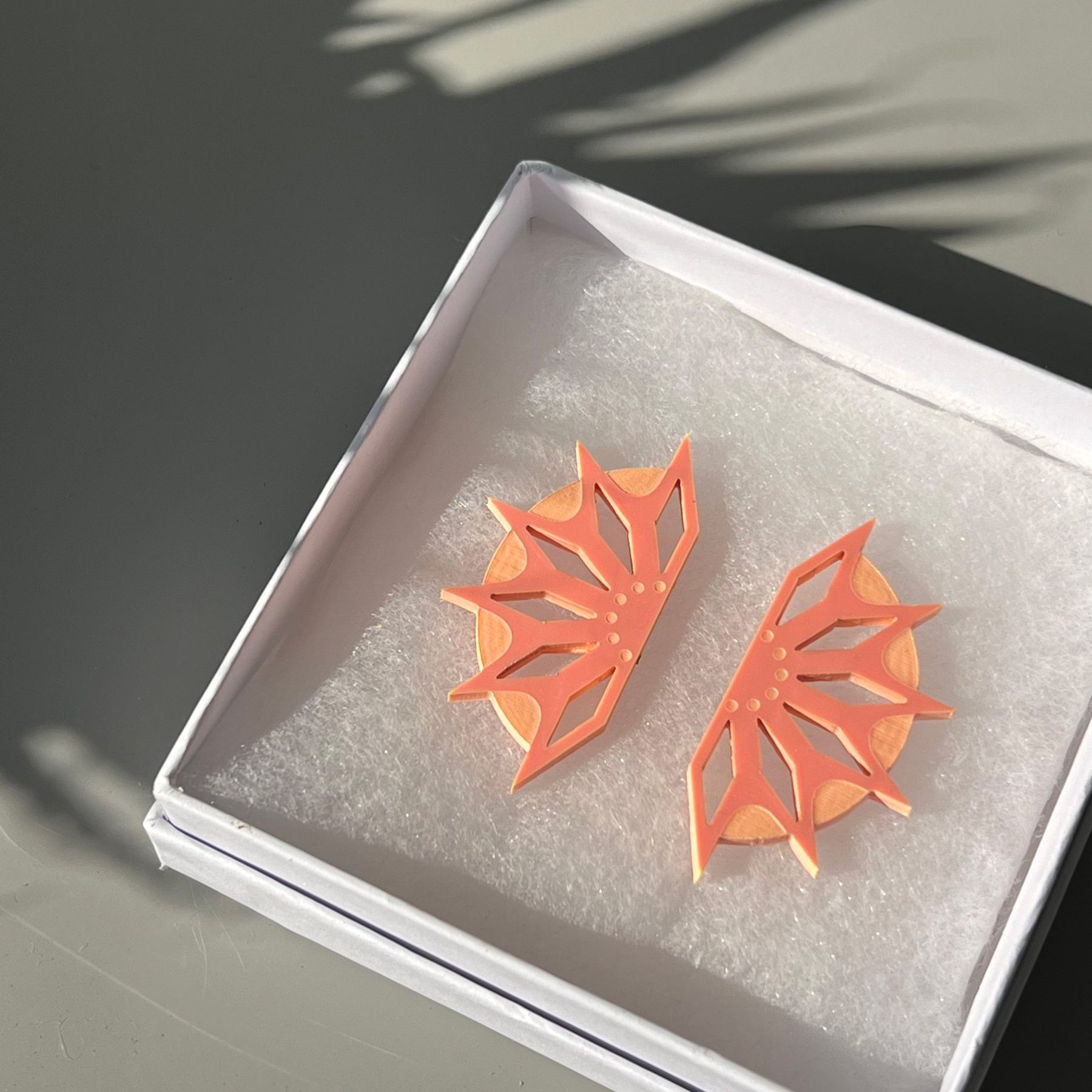 Laser-cut acrylic earrings in a gift box